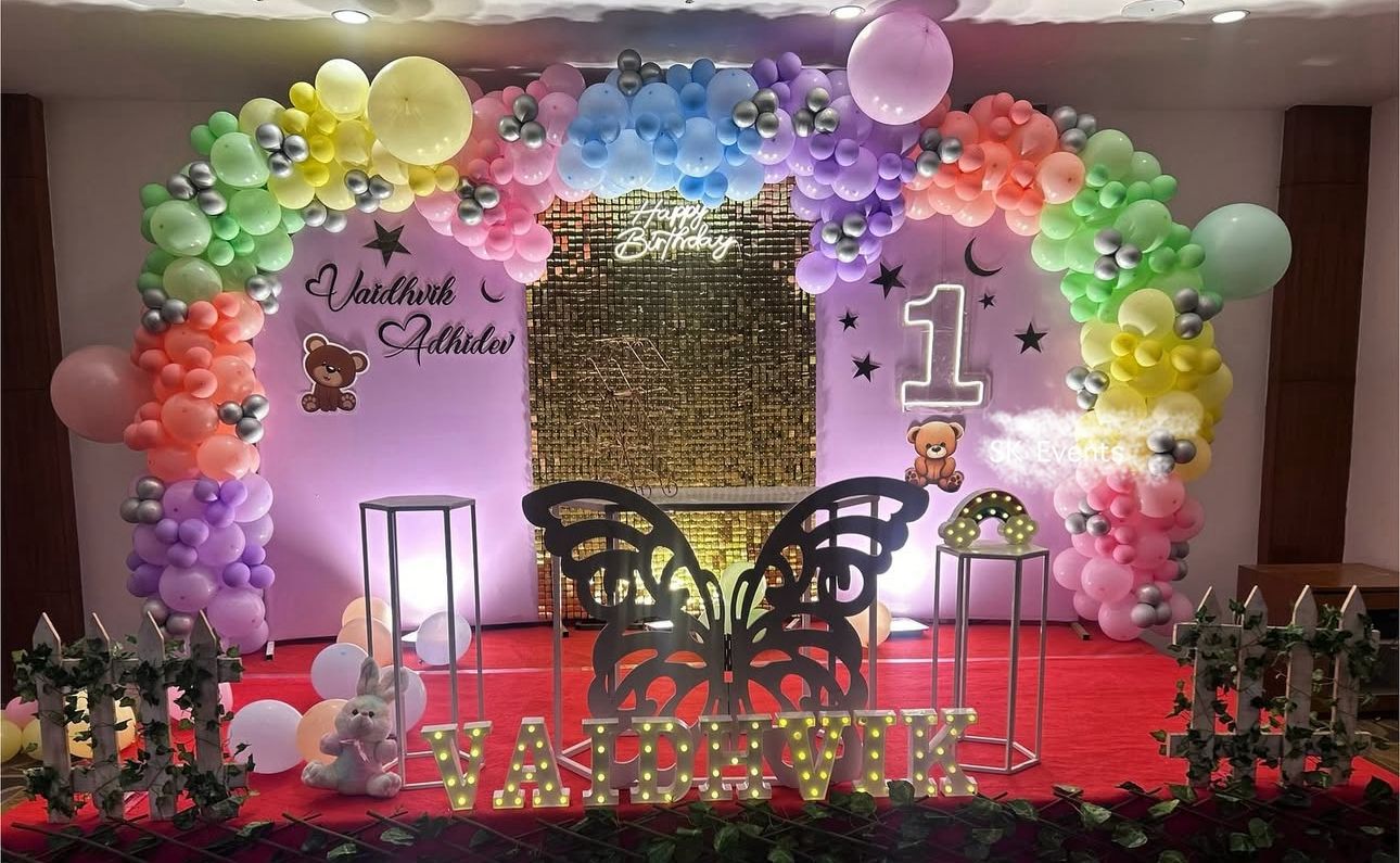 1st Birthday Rainbow-Themed Party Decoration Kit – Colorful Balloon Arch, Butterfly Cutout, Personalized Neon Name Sign & Custom Backdrops